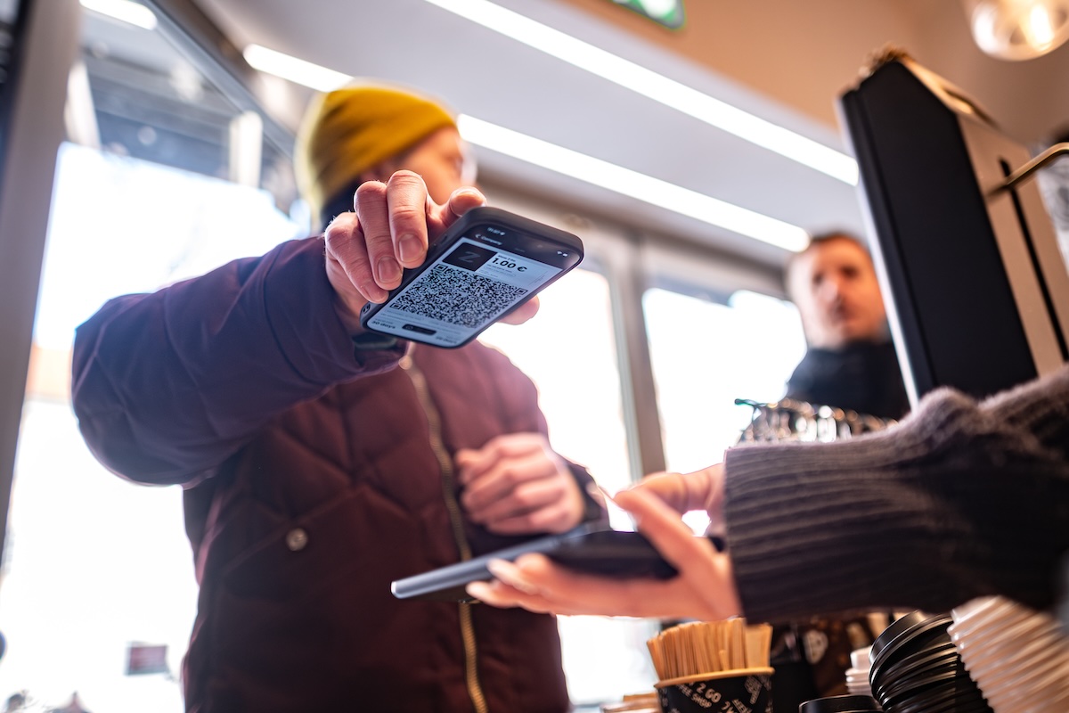 Customer using Zenth at a shop counter